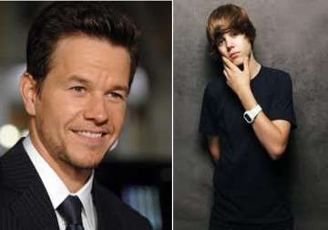 justin bieber working hard on his acting debut says mark wahlberg