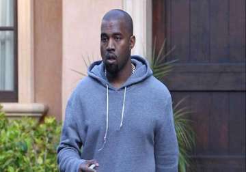 kanye west accused of attacking photographer