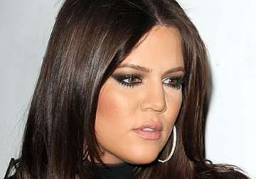 khloe kardashian puts family plans on hold