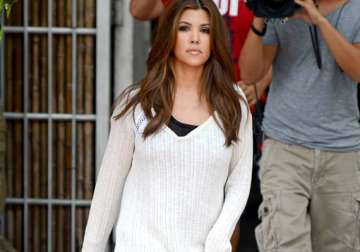 kourtney flashes derriere