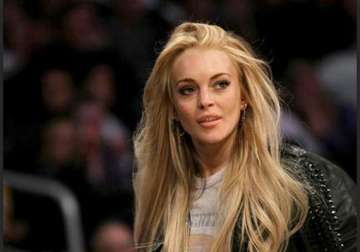 lindsay lohan happy in rehab says mother