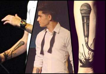 zayn malik wants armful of tattoos