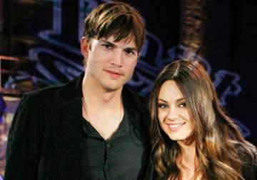 mila kunis living with ashton kutcher