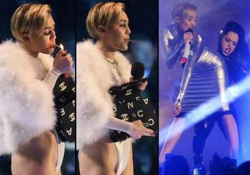 miley cyrus continues to be bad girl smokes cigarette onstage at ema awards view pics
