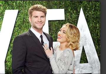 miley cyrus postpones her wedding to liam hemsworth