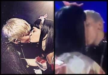 miley cyrus embarasses again locks lips with katy perry on stage see pics