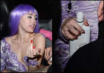 miley cyrus spotted with liquor bottle see pics