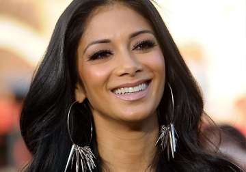 nicole scherzinger hides heartache from work