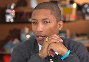 pharrell williams signs with columbia records