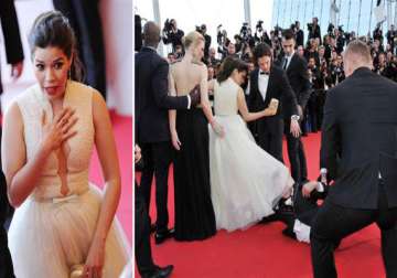 prankster crawls under hollywood star america ferrera s dress at cannes premier