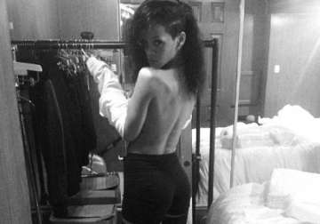 rihanna shares topless photo online