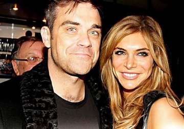 robbie williams to move back to us for wife