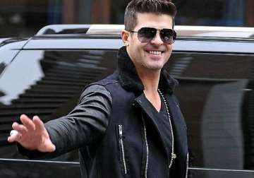 robin thicke dwells into music post separation with paula