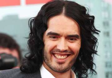 russell brand turns yoga teacher