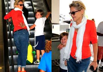 at 56 sharon stone goes brighter with colour orange