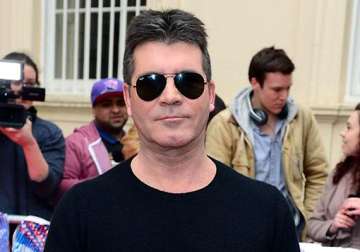 simon cowell excited to become father