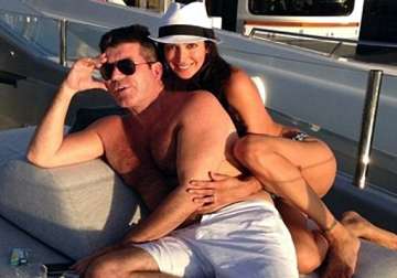 simon cowell to give pregnant lover a mansion