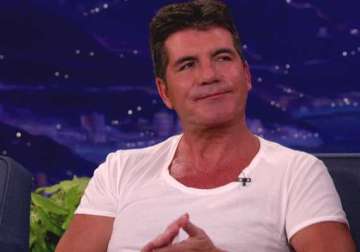 simon cowell to name first child after father