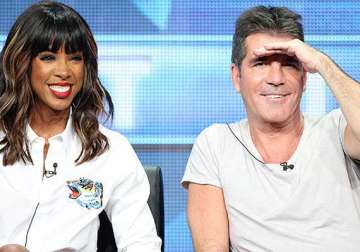 simon cowell will be a cool dad kelly rowland