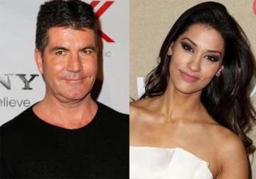 simon cowell dating janina gavankar