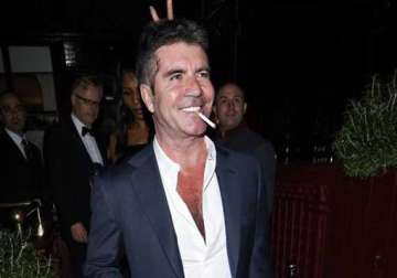 surreal simon cowell says seeing baby scan