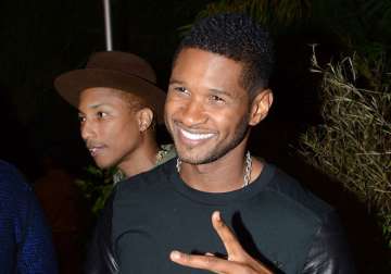 usher quits the voice for his kids