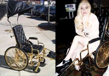 watch lady gaga using a 24k gold plated wheelchair after hip surgery
