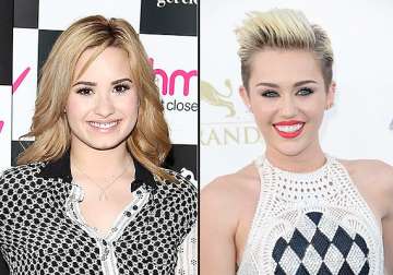 lovato compares her transition with miley cyrus