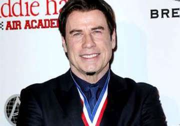 john travolta tones down footwork in public