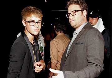 justin bieber hits back at rogen says sorry for not bowing down