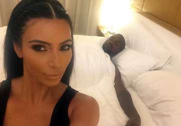 kim kardashian posts selfie with sleeping kanye west in bed see pics