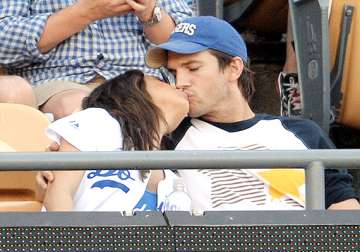 mila kunis ashton kutcher kisses each other cuddles up publicly see pics