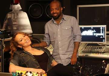 mariah carey splits with producer after bad sales