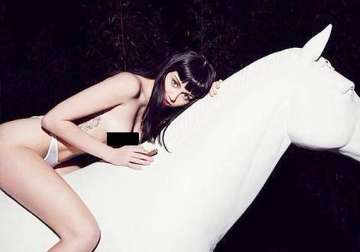miley cyrus poses completely naked over a white horse crosses limits this time see pics