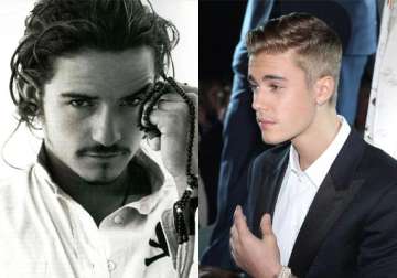 orlando bloom throws punch at justin bieber