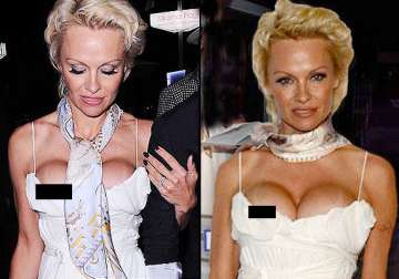hot pamela anderson reveals huge cleavage faces clear wardrobe malfunction see pics