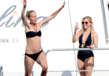 reese witherspoon flaunts fantastic figure in swim suit