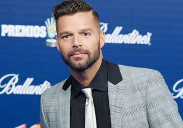 ricky martin takes sons on tour for stability