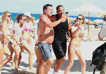 actor will smith mobbed by topless fans in ibiza
