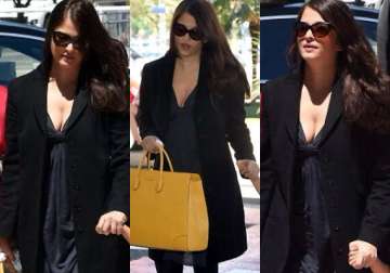 aishwarya spotted in cleavage revealing outfit at cannes airport see pics