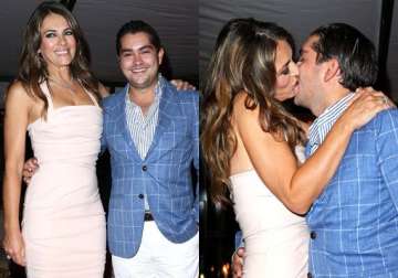 kiss to charity man gives away 50 000 pounds for a kiss with elizabeth hurley