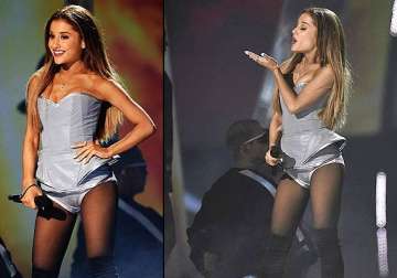 ariana grande shimmers in silver leotard