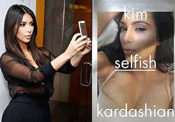 kim kardashian flaunts cleavage for selfish