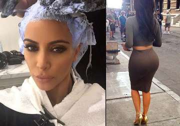 kim kardashian sheds her sexy blonde image goes dark again