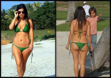 after kim sis kourtney kardashian flaunts her curves in green bikini