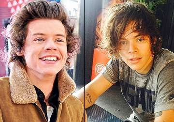 harry styles ditches quiff for matted down hairdo