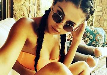 brave selena gomez posts selfie in skimpy orange bikini see pics