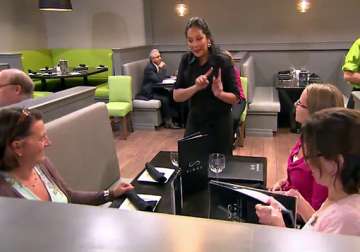 restaurant where customers use sign language to place orders watch video