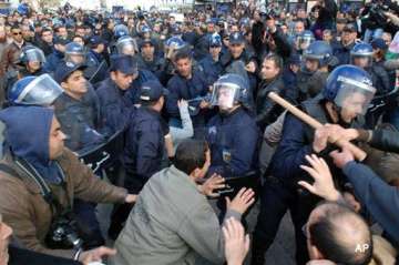 thousands demand reforms in algeria 400 arrested