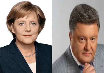 angela merkel congratulates poroshenko vows more support for ukraine